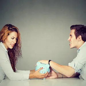 Image of a man and woman with a piggy bank